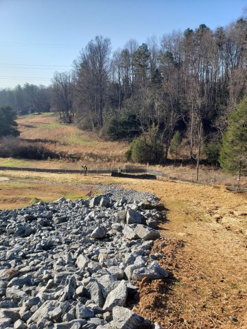Civil grading job site with riprap and cleared land